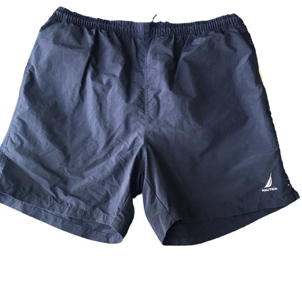 Nautica size L men’s swim trunks navy with yellow accents. Drawstring cl…